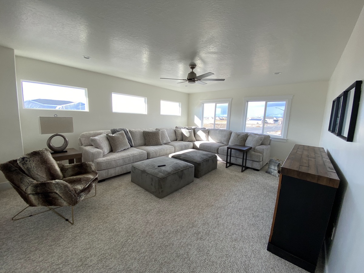 Comfortable living room with a large sectional and mountain views