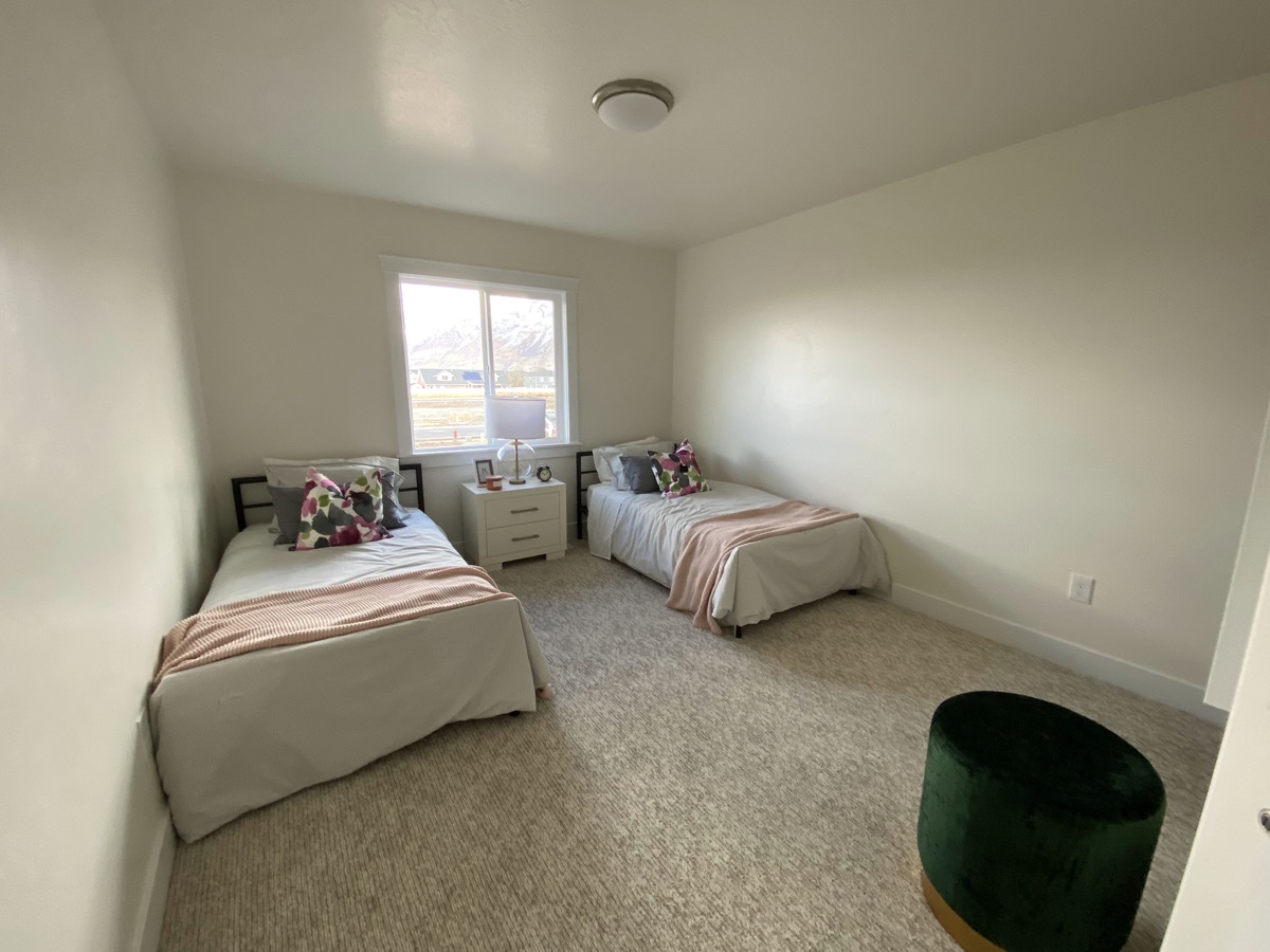 Bedroom arranged with two beds