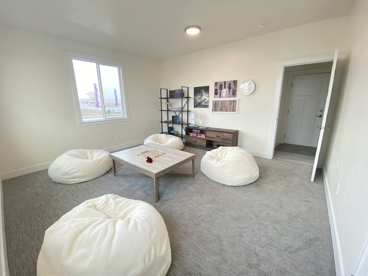 Casual upstairs lounge with soft floor seating