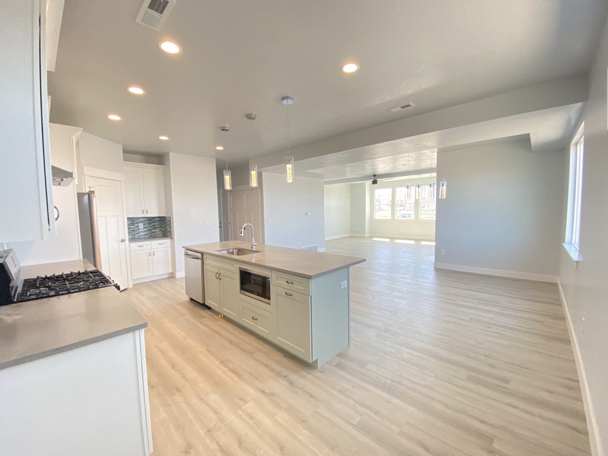 Bright kitchen and dining space with a long center island