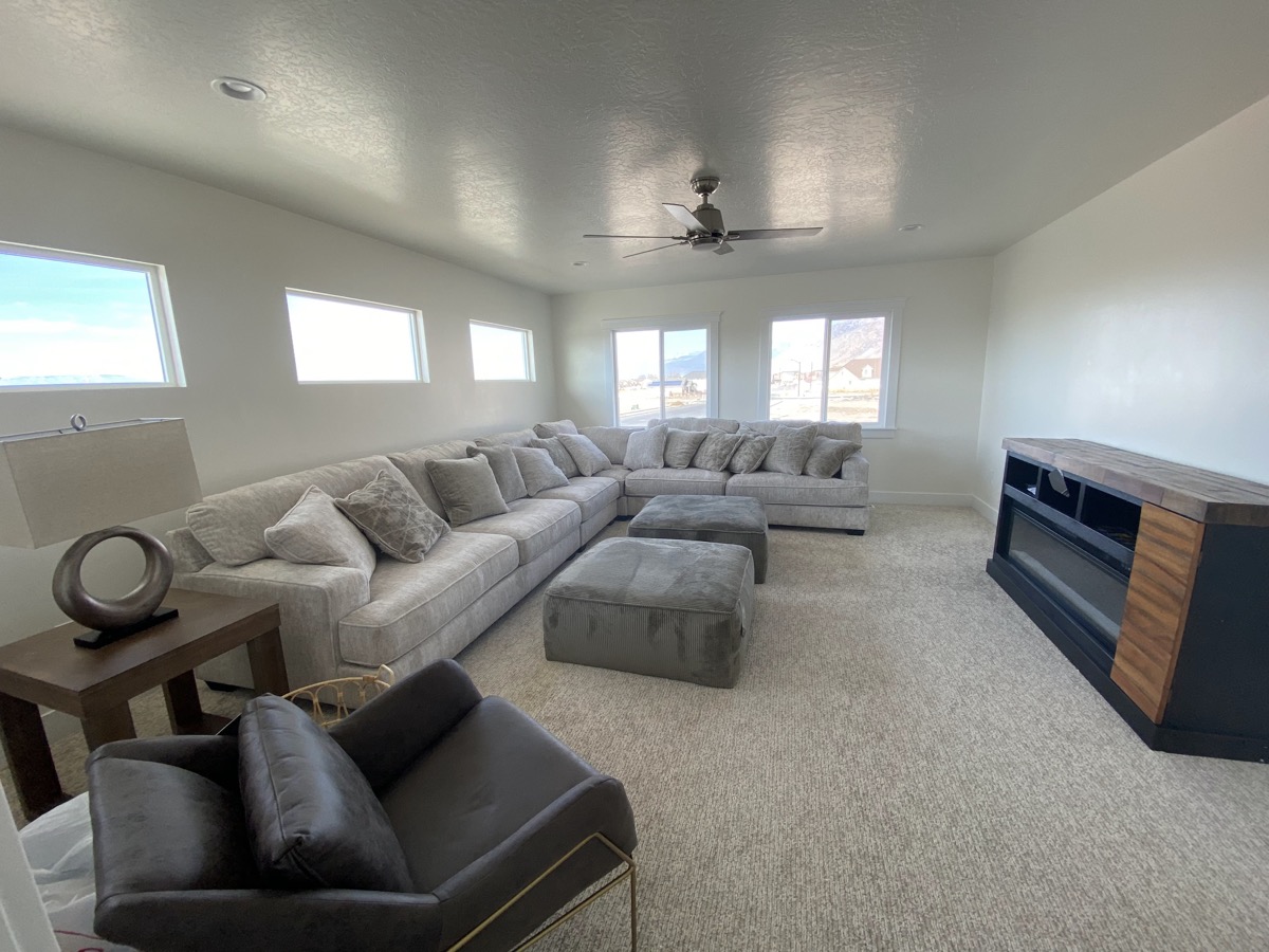 Large living room with a sectional and long media console